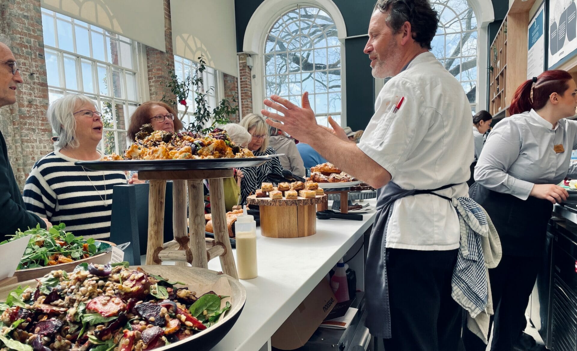 chef talking to customer at the orangery