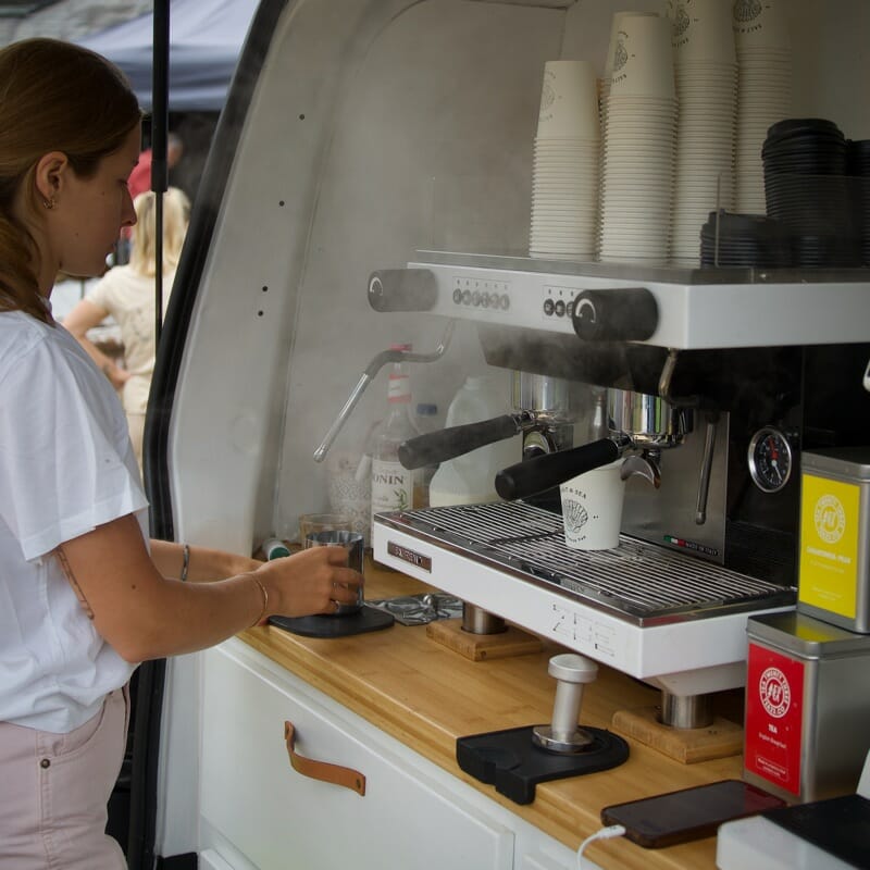 Serving coffee at the market